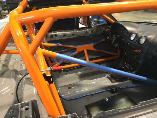 A close up of the back of an orange car.