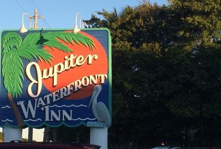 A sign for the jupiter waterfront inn.