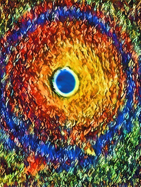A colorful painting of an eye with many colors.